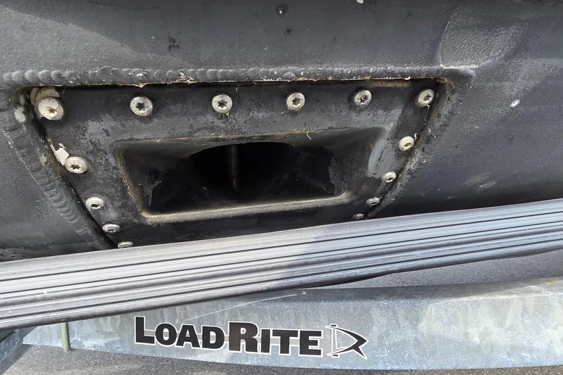 Slide: The Image of Close-up of Barletta Lusso 25UCA 2025 boat hull on LoadRite trailer. - 20
