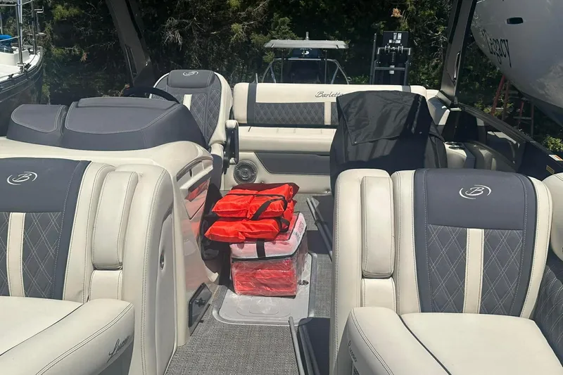 Slide: The Image of 2025 Barletta Lusso 25UCA interior with luxurious seating and safety gear. - 25