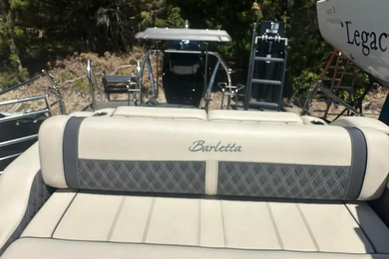 Slide: The Image of 2025 Barletta Lusso 25UCA boat interior with luxurious seating and elegant design. - 26