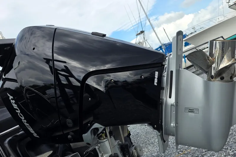 Slide: The Image of Close-up of a Mercury outboard motor on a 2025 Barletta Lusso 25UCA boat. - 5