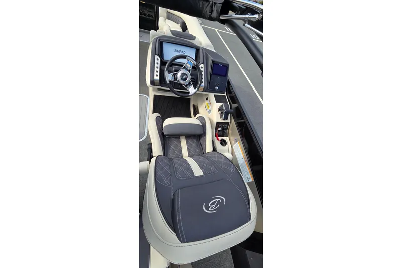Slide: The Image of 2025 Barletta Lusso 25UCA boat cockpit with steering wheel and control panel. - 6