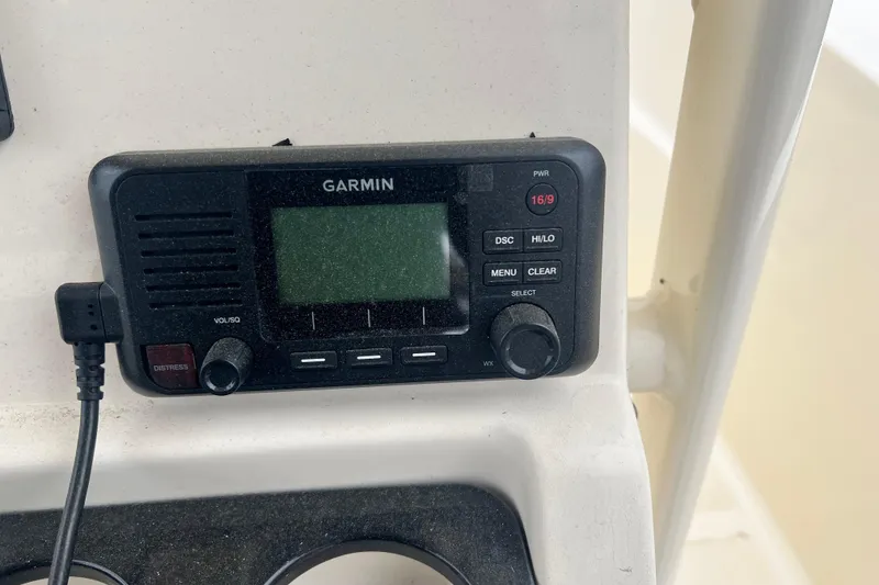 Slide: The Image of Garmin marine radio on 2020 Scout 195 Sportfish boat dashboard. - 11