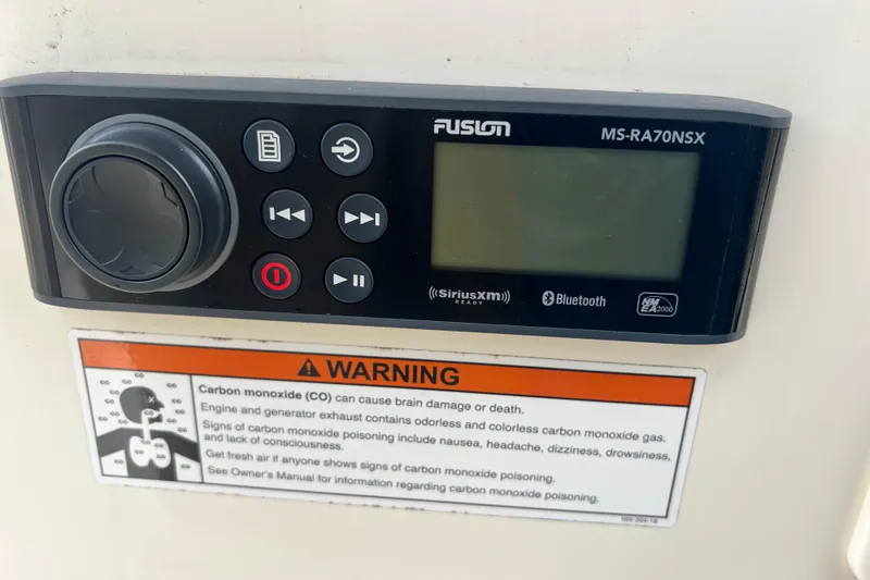 Slide: The Image of Fusion MS-RA70NSX stereo system on 2020 Scout 195 Sportfish with carbon monoxide warning label. - 13