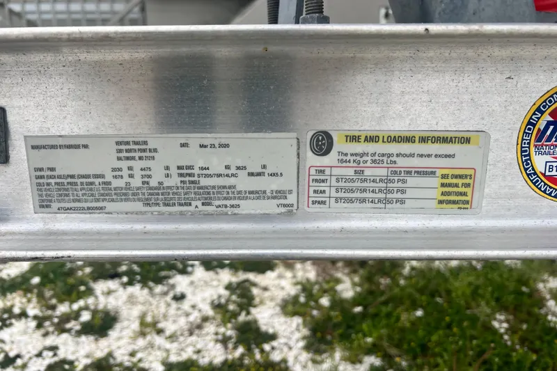 Slide: The Image of 2020 Scout 195 Sportfish trailer label with tire and loading information, manufactured by Venture Trailers. - 14