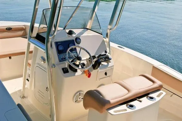 Slide: The Image of Manufacturer Provided Image: 2020 Scout 195 Sportfish boat interior with steering console and seating. - 2