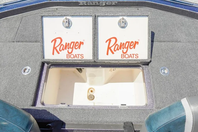 Slide: The Image of 2025 Ranger Z520 boat storage compartments with Ranger Boats branding. - 14