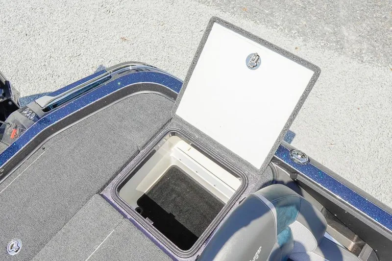 Slide: The Image of Open storage compartment on 2025 Ranger Z520 boat deck. - 15