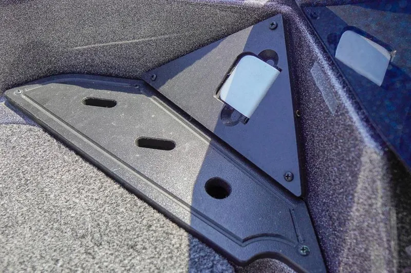 Slide: The Image of Interior detail of 2025 Ranger Z520 boat, featuring a triangular compartment with textured surfaces. - 18