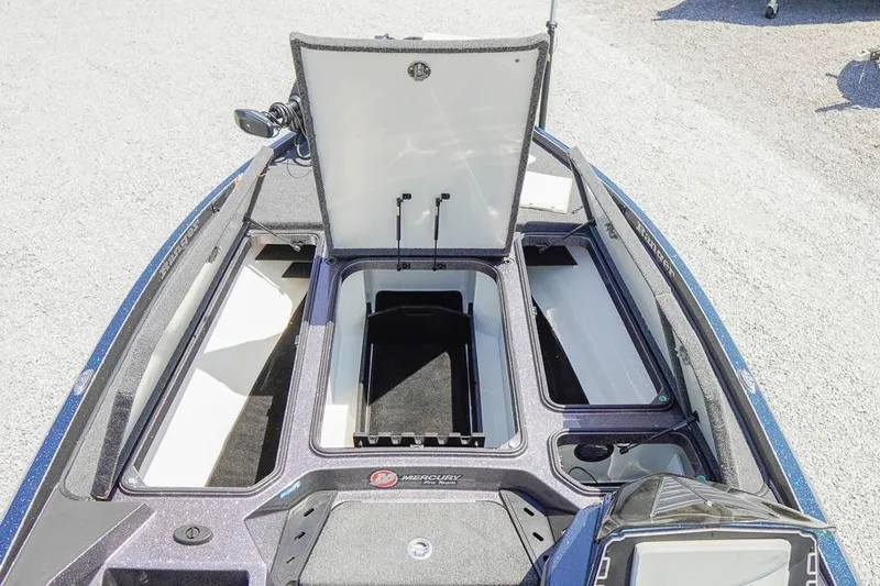 Slide: The Image of 2025 Ranger Z520 boat storage compartments open, showcasing spacious interior design. - 19