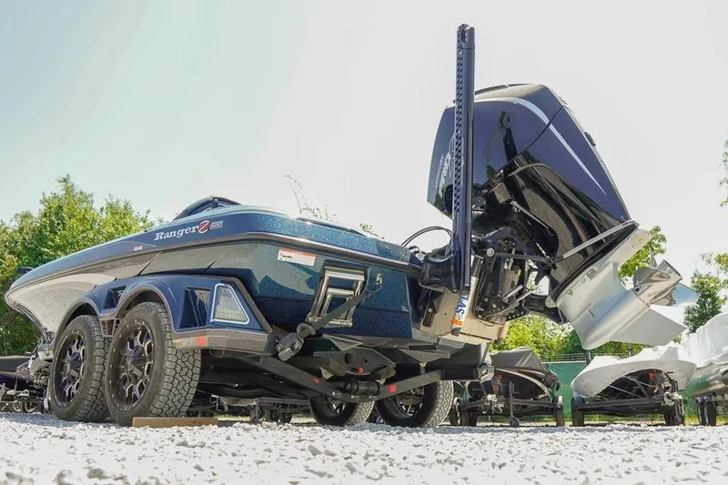 Slide: The Image of 2025 Ranger Z520 boat on trailer, featuring powerful outboard motor. - 3
