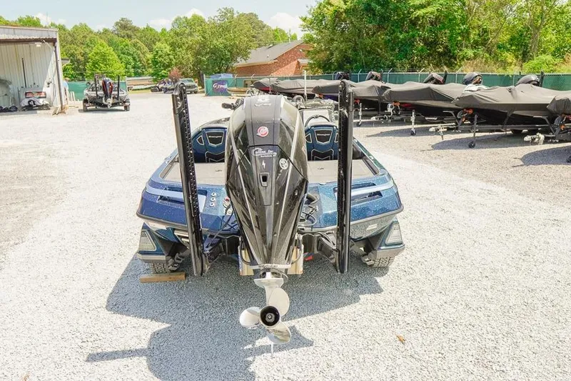 Slide: The Image of 2025 Ranger Z520 boat with powerful outboard motor in a sunny outdoor setting. - 4