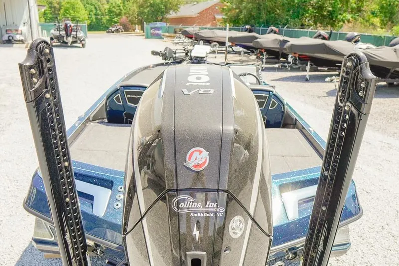 Slide: The Image of 2025 Ranger Z520 boat with V8 engine, parked outdoors in a dealership lot. - 7