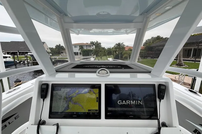 Slide: The Image of 2019 Invincible 40 Catamaran helm with dual Garmin displays and navigation equipment. - 12