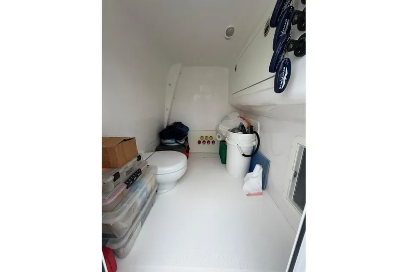 Slide: The Image of Interior of 2019 Invincible 40 Catamaran with storage and toilet facilities. - 18