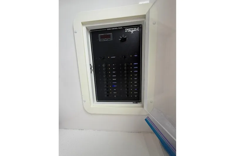 Slide: The Image of Electrical control panel on a 2019 Invincible 40 Catamaran boat. - 19