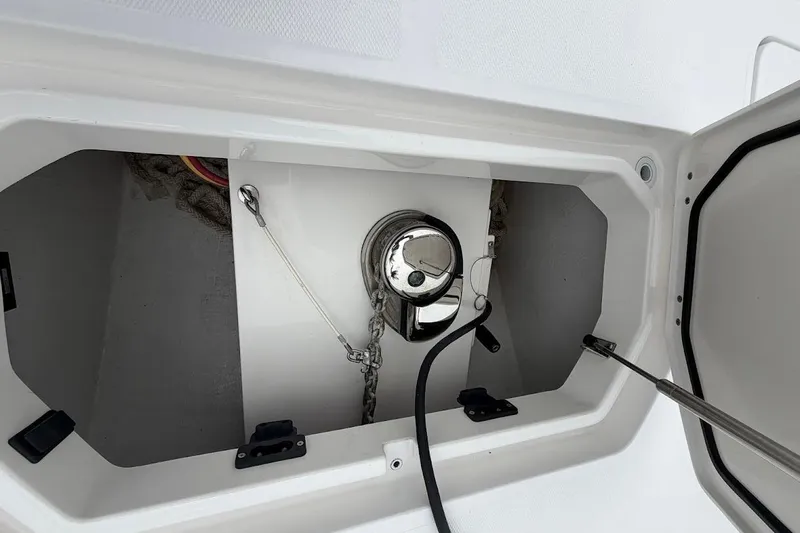 Slide: The Image of Anchor compartment of 2019 Invincible 40 Catamaran with chain and winch. - 20