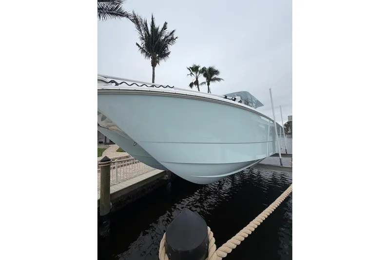 Slide: The Image of 2019 Invincible 40 Catamaran docked, showcasing sleek design and modern features. - 4