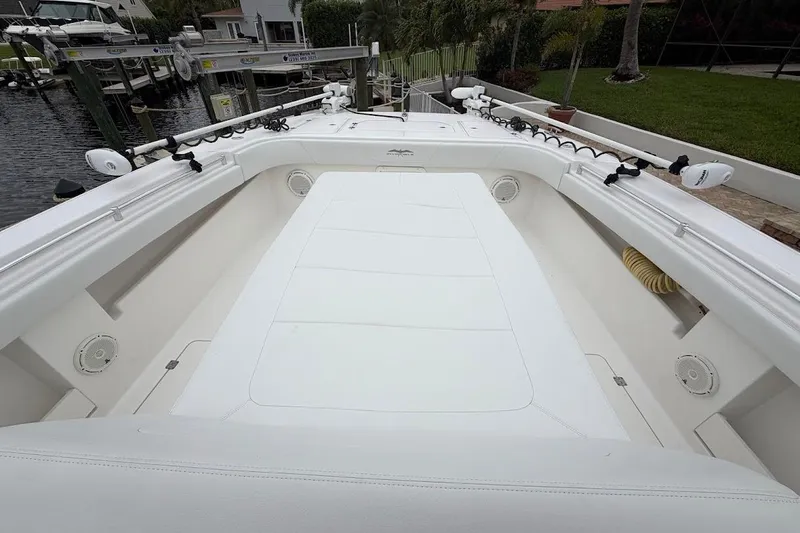 Slide: The Image of 2019 Invincible 40 Catamaran deck, spacious seating, and fishing rod holders. - 7