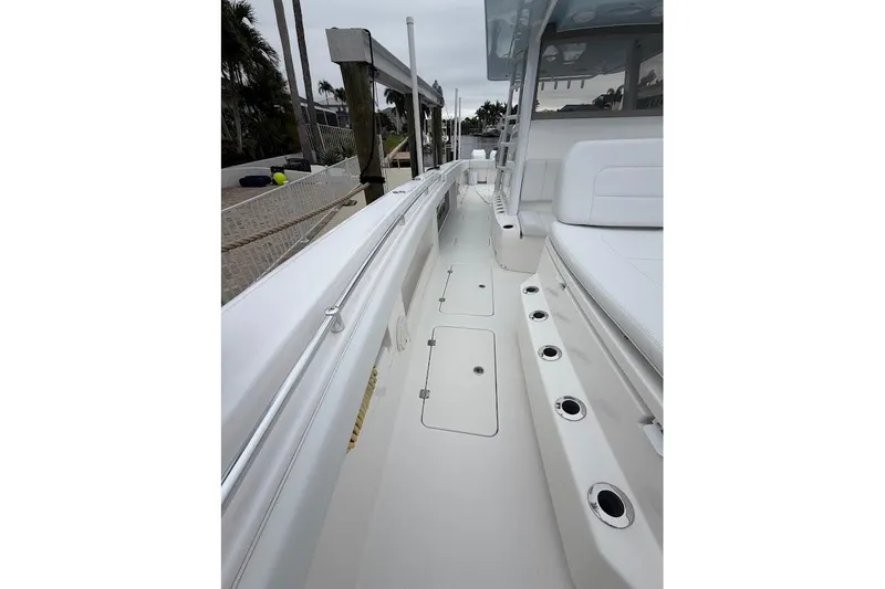 Slide: The Image of 2019 Invincible 40 Catamaran deck view with seating and rod holders. - 9