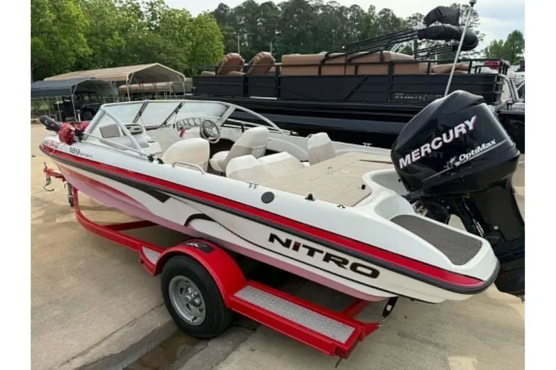 Slide: The Image of 2009 Nitro 189 Sport boat with Mercury outboard engine on a red trailer. - 1