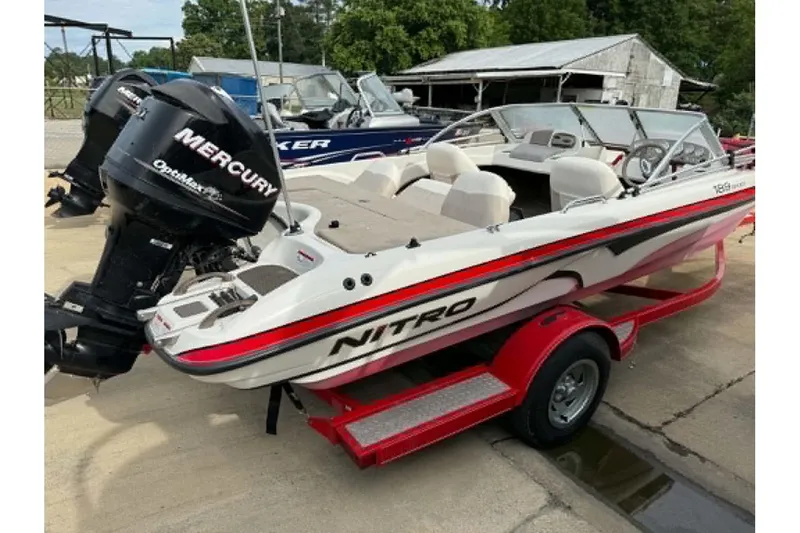 Slide: The Image of 2009 Nitro 189 Sport boat with Mercury engine on red trailer. - 3