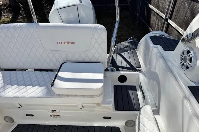 Slide: The Image of 2024 Zodiac Medline 7.5 GT boat interior with white quilted seating and modern design. - 18