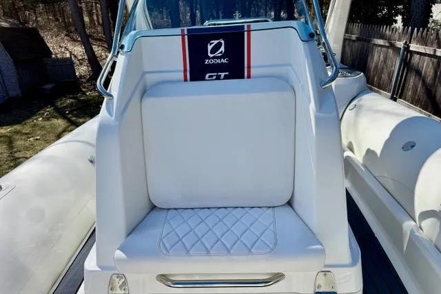 Slide: The Image of 2024 Zodiac Medline 7.5 GT boat with white seating and GT branding. - 19