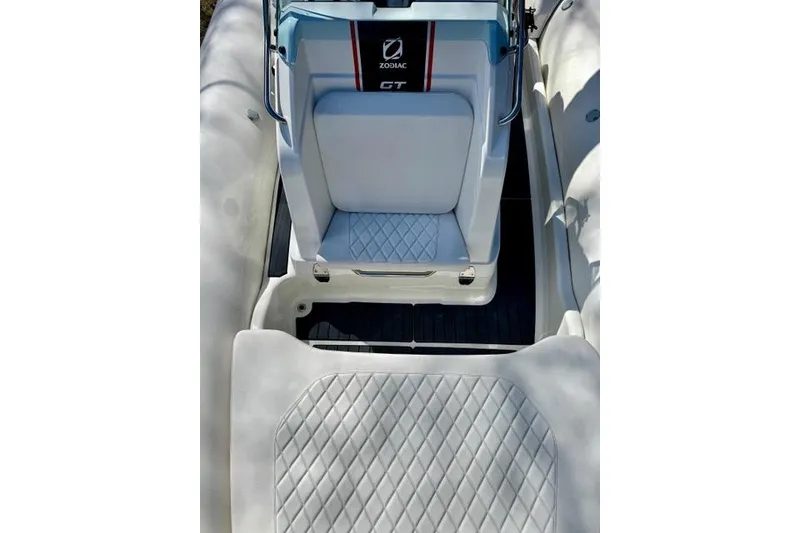 Slide: The Image of 2024 Zodiac Medline 7.5 GT boat interior with quilted seating and sleek design. - 20