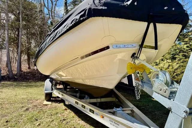 Slide: The Image of 2024 Zodiac Medline 7.5 GT boat on trailer, covered, parked on grass. - 25