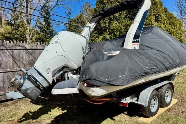 Slide: The Image of 2024 Zodiac Medline 7.5 GT boat on trailer, covered, with outboard motor. - 26