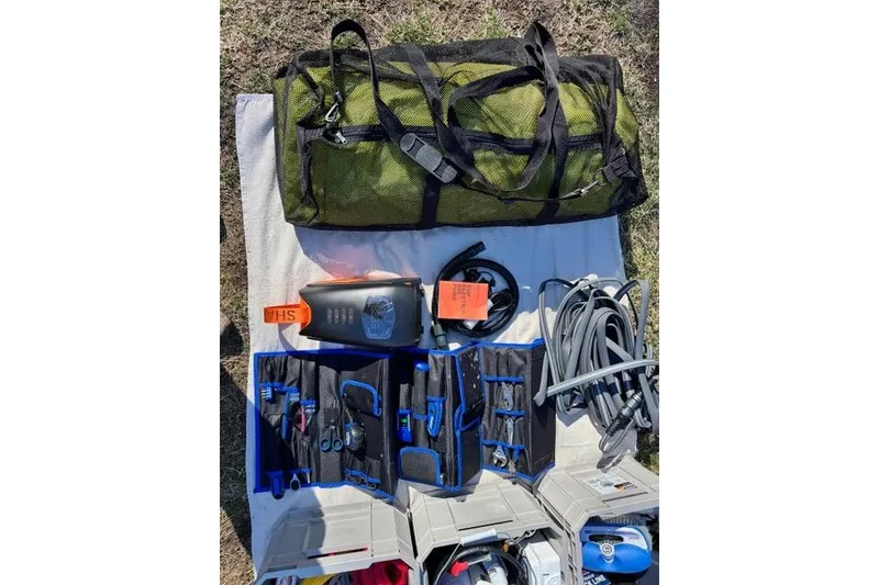 Slide: The Image of Outdoor gear and accessories for Zodiac Medline 7.5 GT 2024, including cables and storage bag. - 29