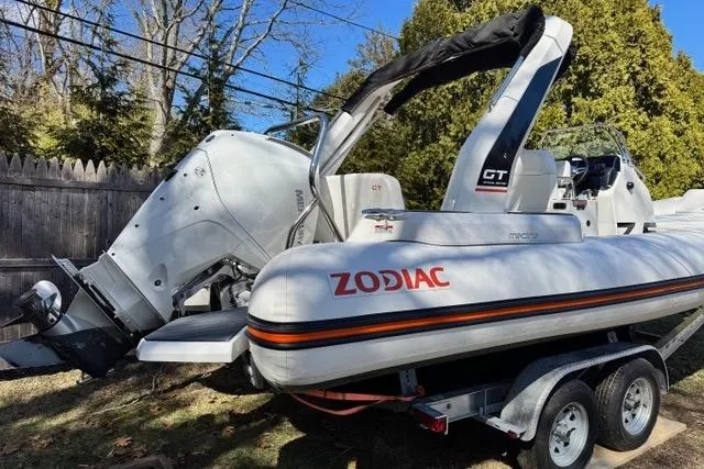Slide: The Image of 2024 Zodiac Medline 7.5 GT boat on trailer, featuring powerful outboard motor. - 3