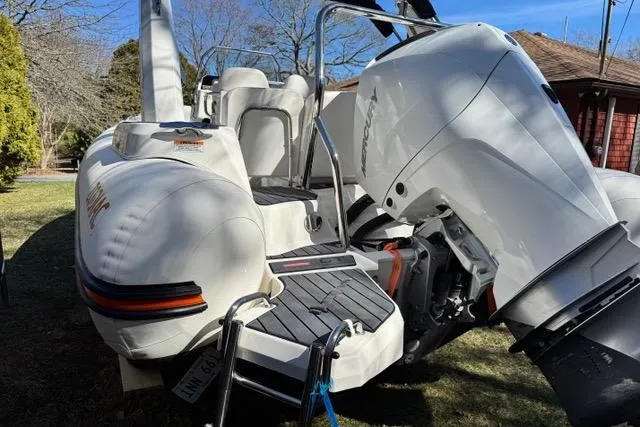 Slide: The Image of 2024 Zodiac Medline 7.5 GT boat with powerful outboard motor, parked outdoors. - 4