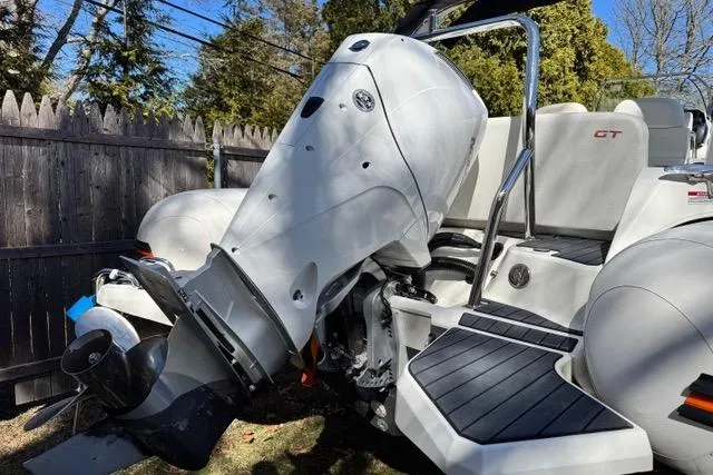 Slide: The Image of 2024 Zodiac Medline 7.5 GT boat with powerful outboard motor, parked outdoors. - 6