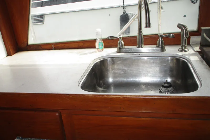 Slide: The Image of Stainless steel sink in 1979 Roughwater 41 boat kitchen interior. - 16