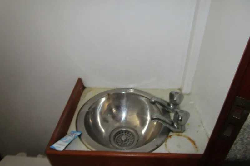 Slide: The Image of Stainless steel sink in 1979 Roughwater 41 boat bathroom. - 27