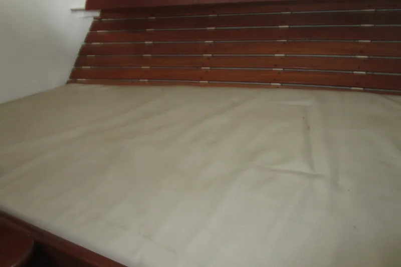 Slide: The Image of Interior cabin bed of 1979 Roughwater 41 boat with wooden slatted headboard. - 28