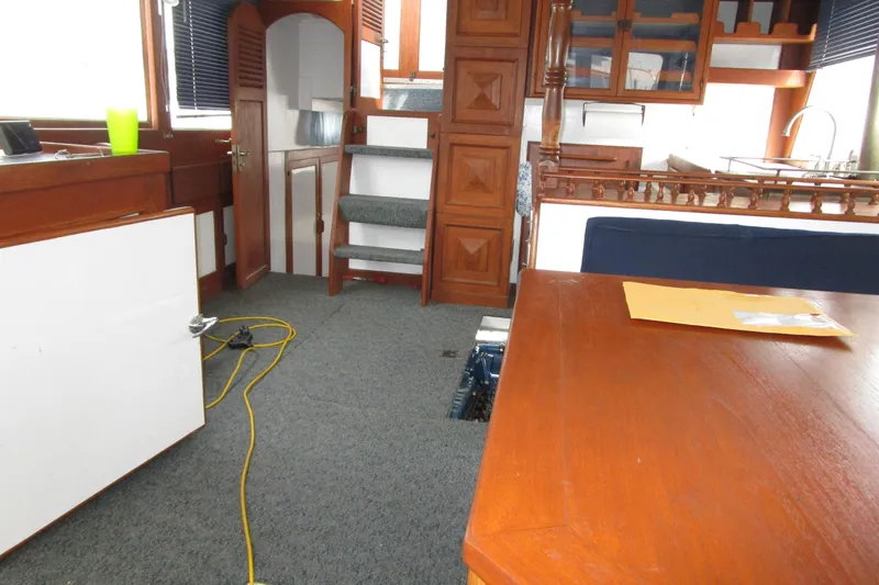 Slide: The Image of Interior of 1979 Roughwater 41 boat with wooden furnishings and carpeted floor. - 30