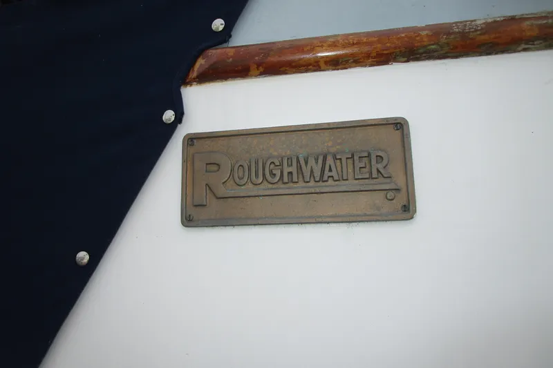 Slide: The Image of Plaque on 1979 Roughwater 41 boat, featuring brand name in bold letters. - 40