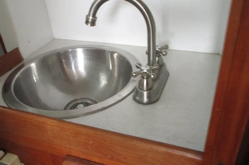 Slide: The Image of Stainless steel sink with faucet in 1979 Roughwater 41 boat interior. - 6