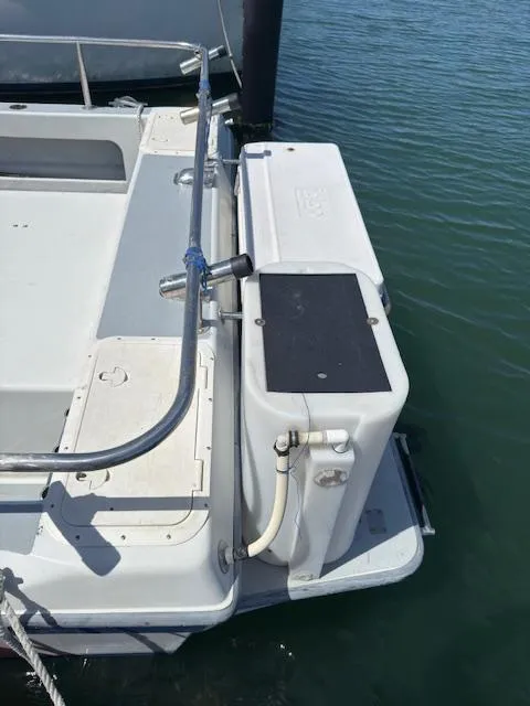 Slide: The Image of 2007 Radon Signature 26 boat stern with railing and water view. - 13