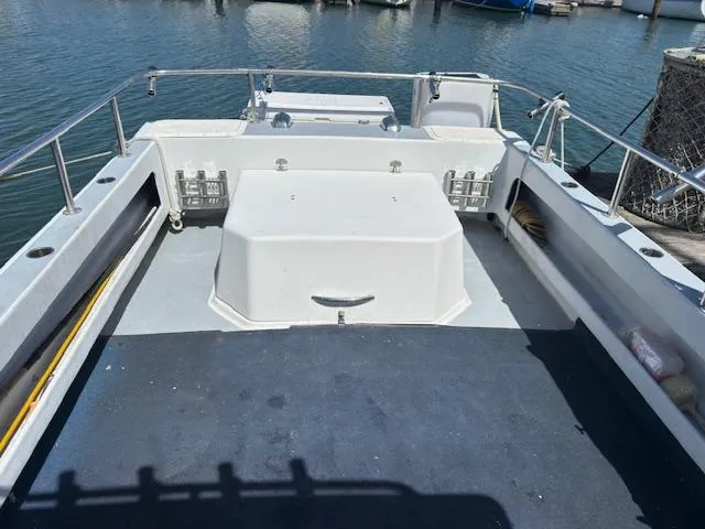 Slide: The Image of 2007 Radon Signature 26 boat deck with railing, docked at marina. - 15
