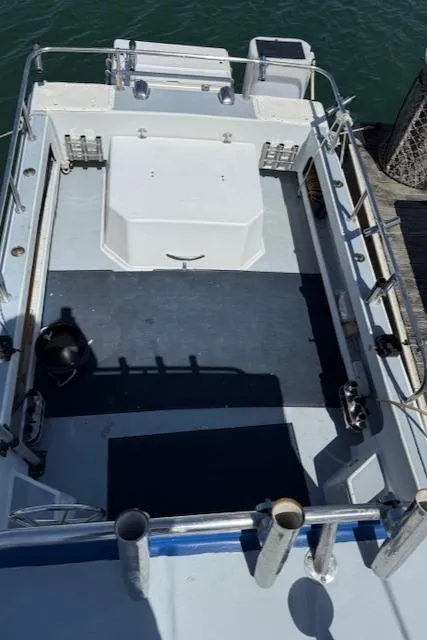 Slide: The Image of 2007 Radon Signature 26 boat deck with railing and storage compartments. - 18