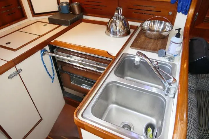 Slide: The Image of Galley kitchen in 1982 Cape Dory 36 sailboat with double sink and stove. - 15