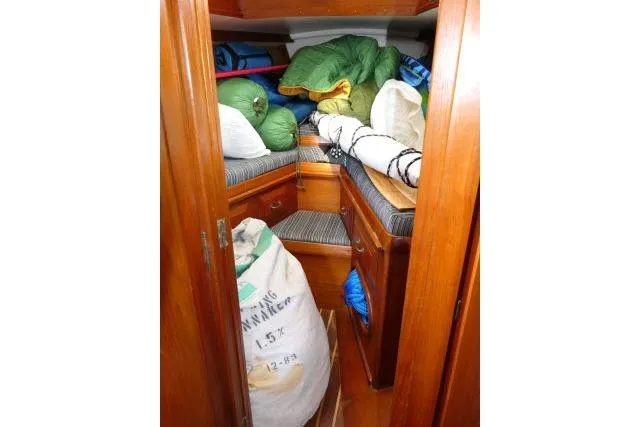 Slide: The Image of Interior cabin of 1982 Cape Dory 36 sailboat with storage and bedding. - 21