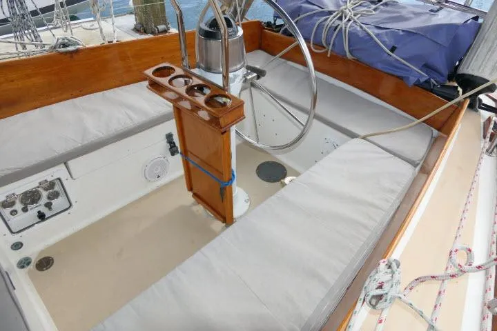 Slide: The Image of Cockpit of 1982 Cape Dory 36 sailboat with wooden accents and steering wheel. - 24