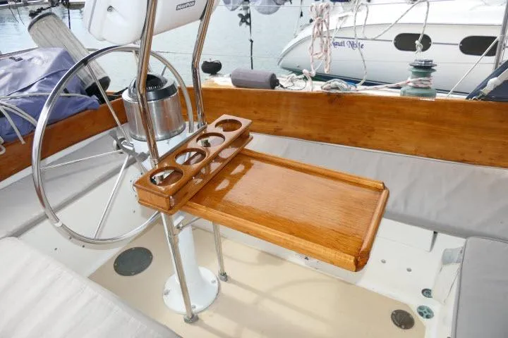 Slide: The Image of Cockpit of 1982 Cape Dory 36 sailboat with wooden table and steering wheel. - 26