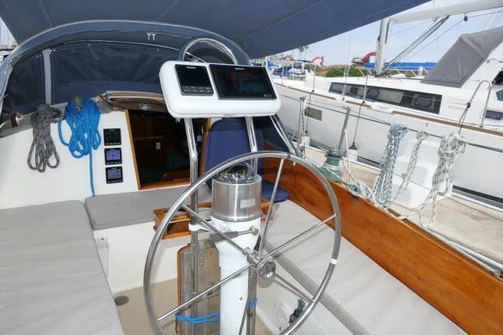 Slide: The Image of Cockpit of a 1982 Cape Dory 36 sailboat with steering wheel and navigation instruments. - 28