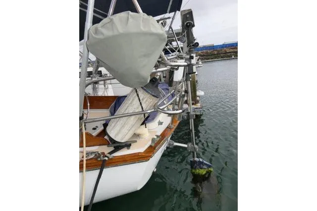 Slide: The Image of 1982 Cape Dory 36 sailboat stern with equipment and water view. - 31