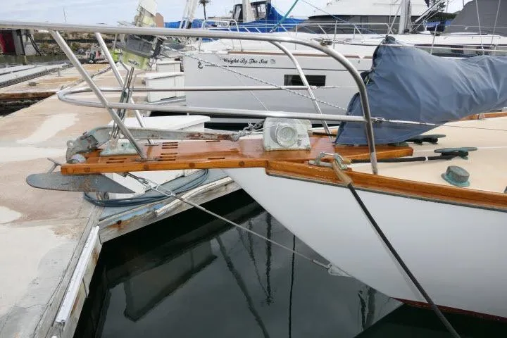 Slide: The Image of 1982 Cape Dory 36 sailboat docked, showcasing bow and deck details. - 43